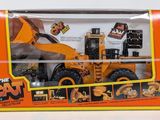 a box with a toy truck in it on a white surface