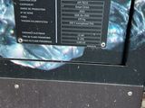 a close up of a microwave on a sidewalk