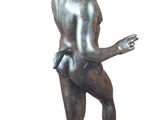 bronze statue of a man with a bird on his head
