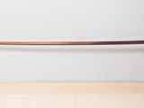 a close up of a glass shelf with a wooden handle on it