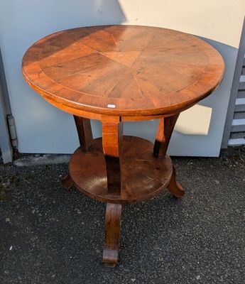 a round table with a wooden top and a wooden base