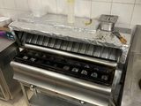 an image of a commercial kitchen with stainless steel appliances