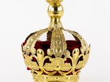 gold crown with red velvet and gold decoration on a white background