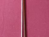 a picture of a pair of scissors on a pink surface
