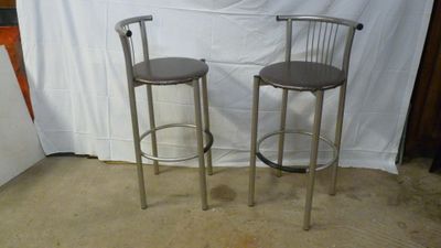 two stools sitting next to each other in a room