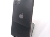 a black iphone sitting on top of a stand