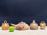five different types of pottery on a table