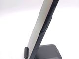 a cell phone that is on a stand on a table