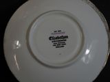 a white plate with a black and white design on it