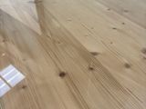a picture of a wooden table with a glass top