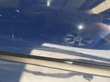 a person cleaning a car with a cloth