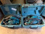 two blue boxes with wires in them sitting on the floor