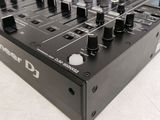 a close up of a dj controller on a table