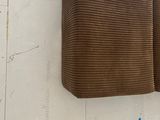 a cardboard box hanging on the wall next to a piece of cardboard