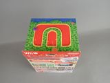 a box with a cake shaped like a letter n on it