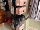a rack with boxes on it in the corner of a room