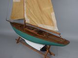 a model of a sailboat on display on a stand