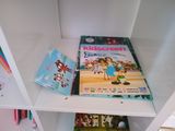 a book that is sitting on a shelf in a book case