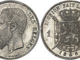 a close up of a coin with a crown on top of it