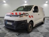 citroen van with red and white stripes parked in a large room