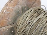 a spool of rope sitting on top of a spool