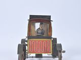 a small toy car with a man sitting in it