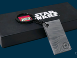 a black box with a keychain and a lego star wars logo on it