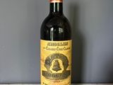 a bottle of wine that is sitting on a table