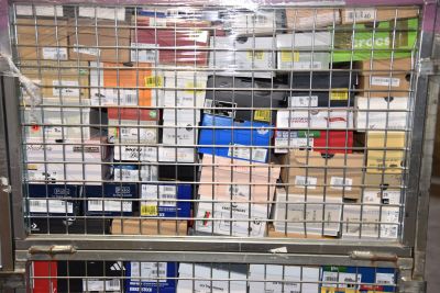 a metal cage with a bunch of boxes in it