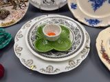 many plates and bowls that are sitting on a table