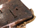 a close up of a piece of wood with a hole in the middle of it