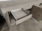 a wooden desk with a drawer underneath it