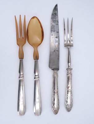 three forks, a spoon, and a knife on a table