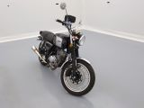 a motorcycle that is sitting in a room on the floor