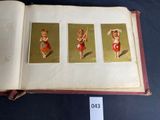 a book with pictures of a little girl in a red dress