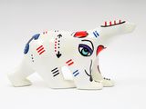 ceramic figurine of a white cat with red, blue, and black stripes