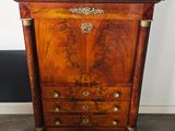 an image of a wooden cabinet with a marble top