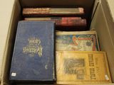 many books in a box on the table