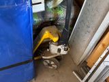 a picture of a blue refrigerator in a garage