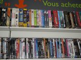 a shelf full of dvds and dvds on a shelf
