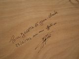 a picture of a piece of wood with writing on it