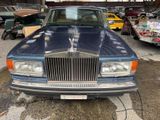 an image of a blue car parked in a garage