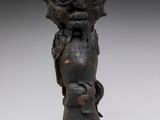 an image of a statue of a head on a stand