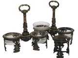 four different pieces of glass and metal on the table