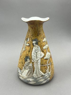 a vase with a picture of a woman and a man on it