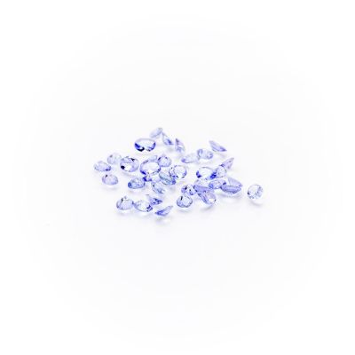 a pile of blue sapphires on a white background