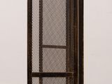 an image of a metal door with a mesh screen on it