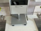 a small table with a drawer on top of it