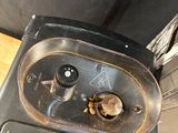 a black stove with a metal burner on top of it