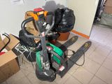 a pile of garbage on the floor next to a forklift